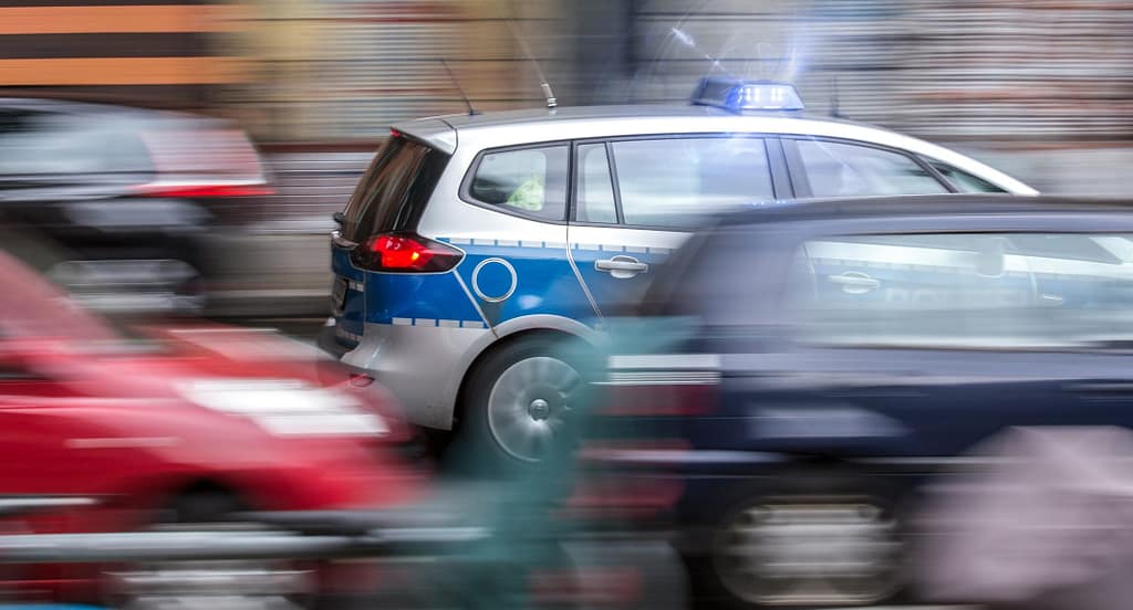 german police car speeding in city traffic